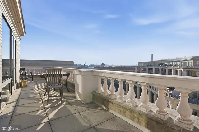 a view of a balcony with wooden floor