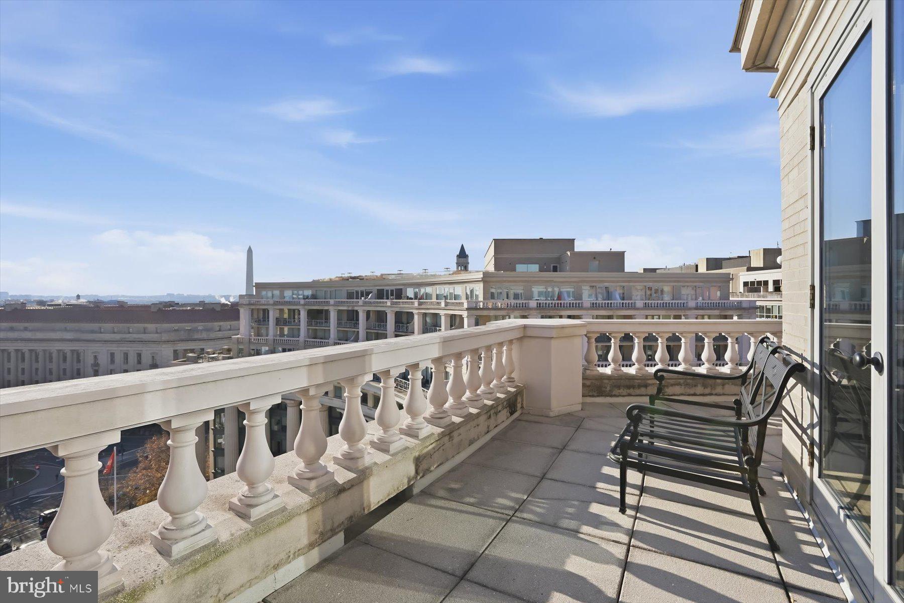 701 Pennsylvania Avenue Northwest, Unit PH21 Washington, DC 20004 - Photo 17 of 18 a view of a balcony with wooden floor