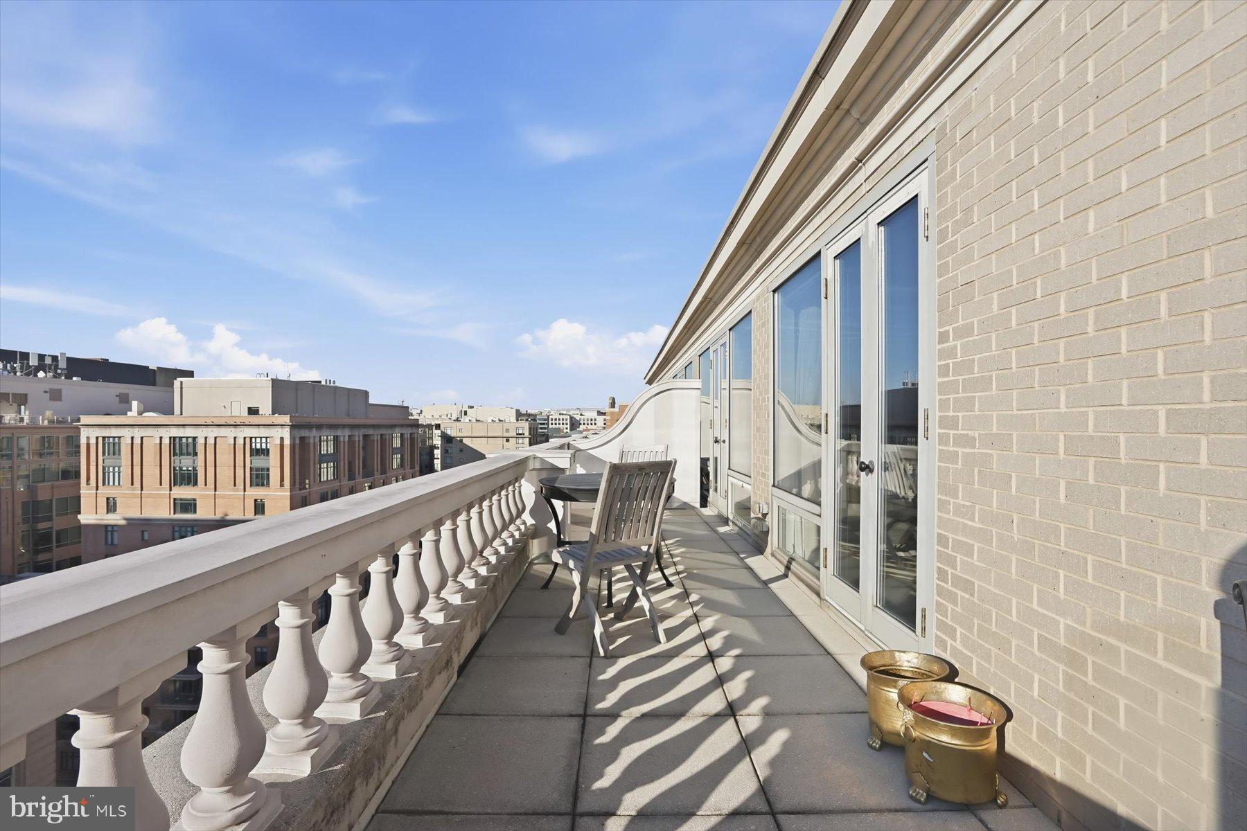 701 Pennsylvania Avenue Northwest, Unit PH21 Washington, DC 20004 - Photo 18 of 18 a view of a balcony with chairs