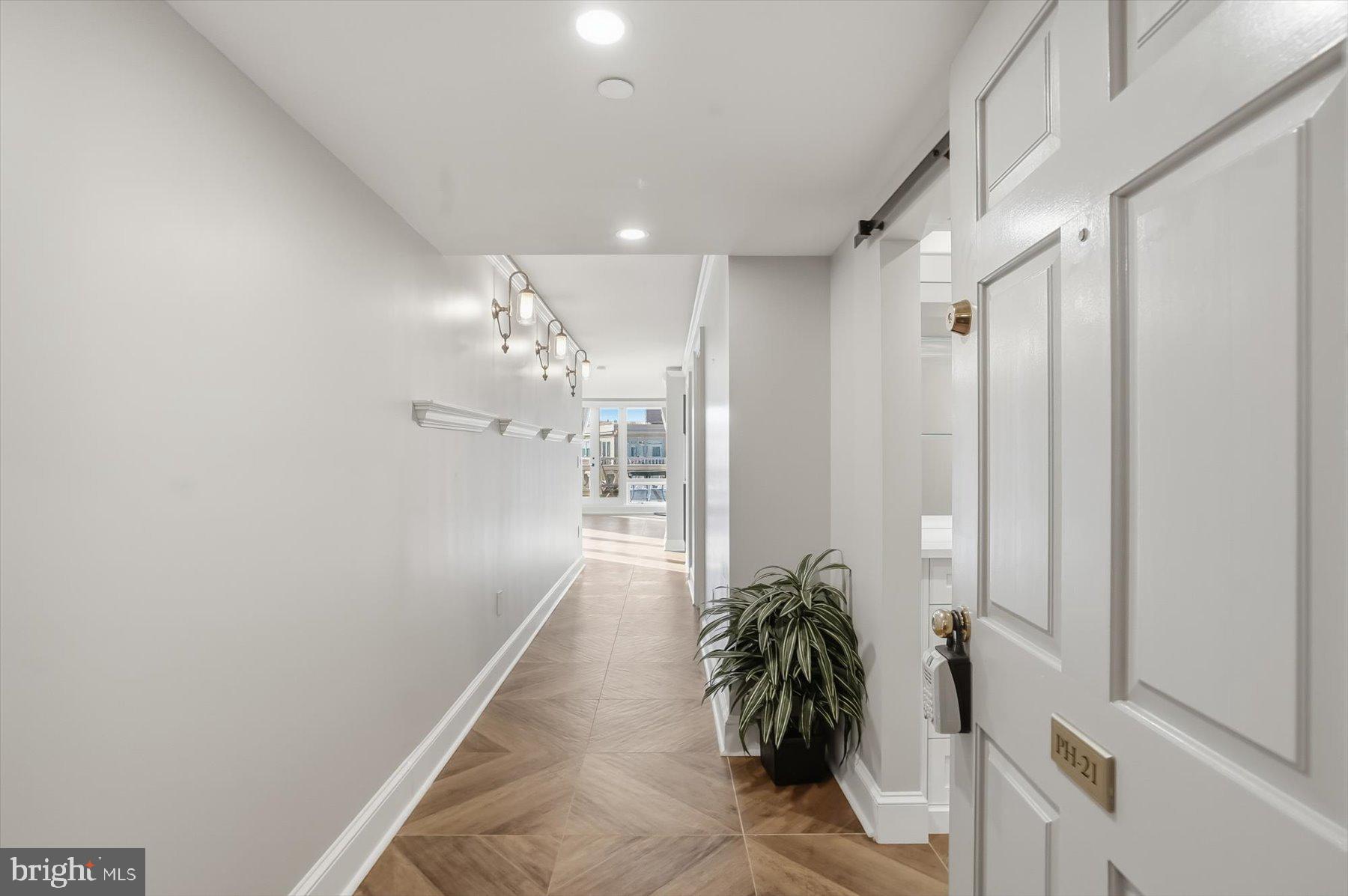 701 Pennsylvania Avenue Northwest, Unit PH21 Washington, DC 20004 - Photo 3 of 18 a room with window and a potted plant
