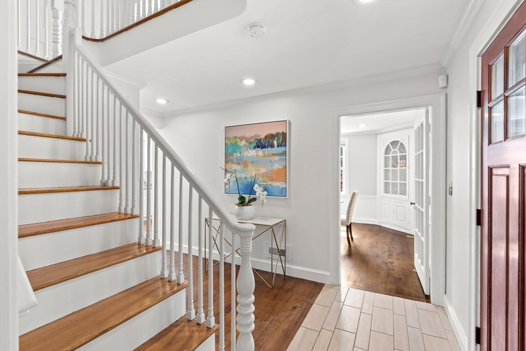6 Shetland Road Marblehead, MA 01945 - Photo 17 of 39 a view of entryway with wooden floor and stairs