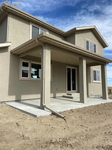 a front view of a house with garage