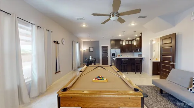 a view of a livingroom with furniture and windows