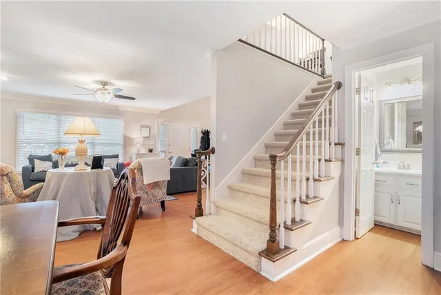 a view of a livingroom with furniture and stairs