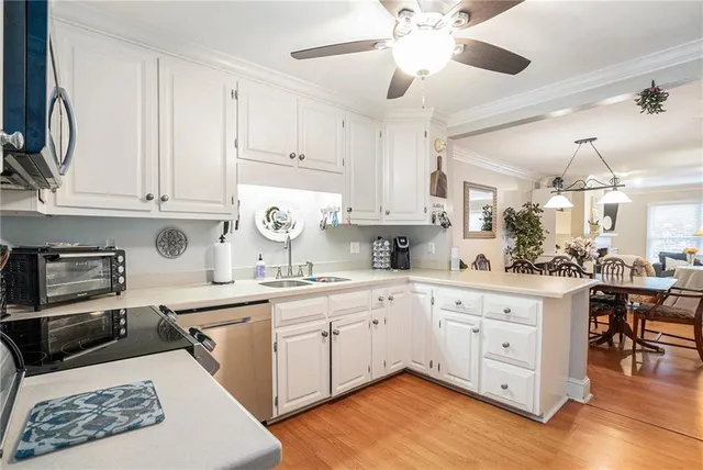 a kitchen with stainless steel appliances granite countertop a sink and cabinets