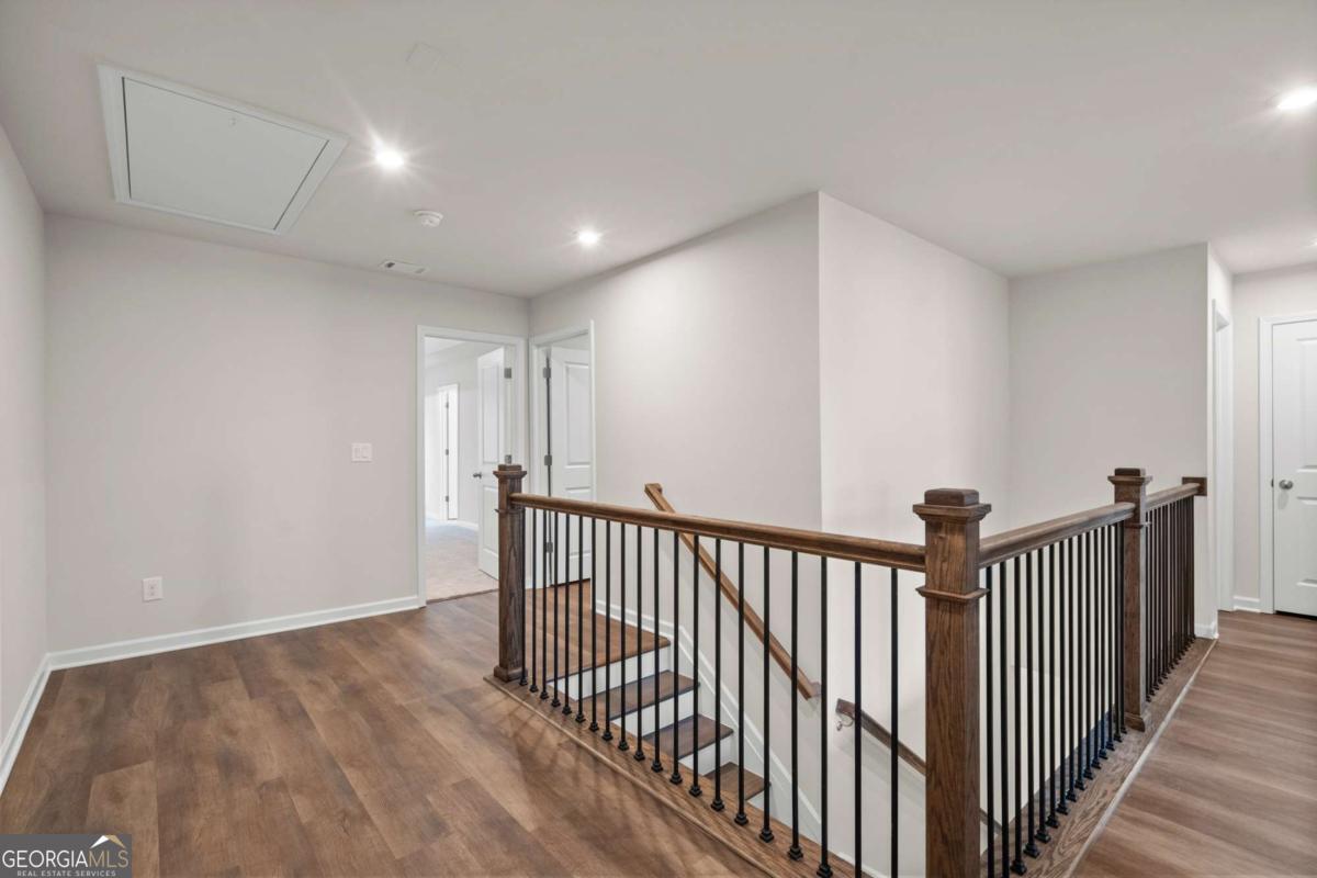 706 Smokey Quartz Way Kennesaw, GA 30144 - Photo 20 of 35 a view of a hallway with wooden floor