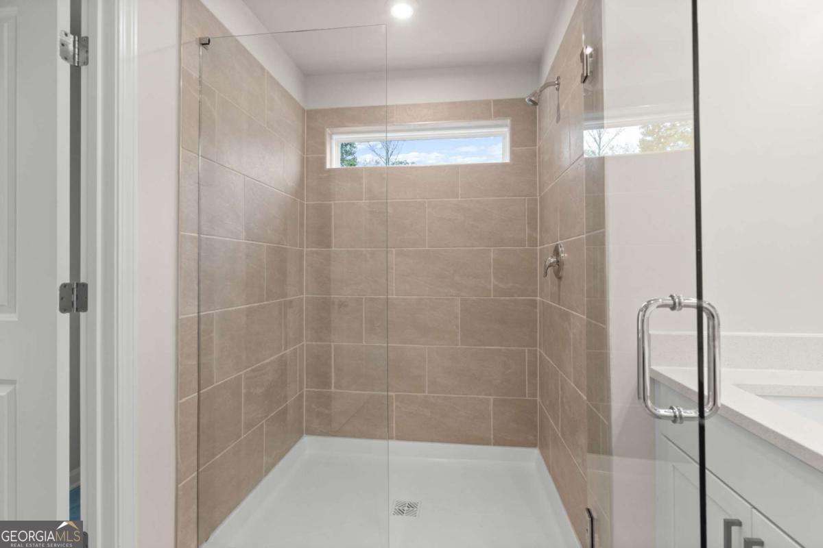 706 Smokey Quartz Way Kennesaw, GA 30144 - Photo 25 of 35 a bathroom with a shower