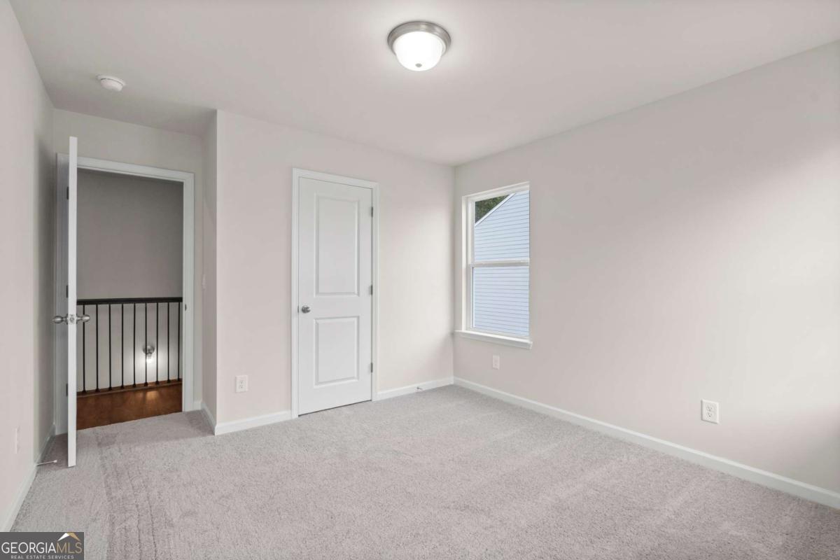 706 Smokey Quartz Way Kennesaw, GA 30144 - Photo 30 of 35 an empty room with windows