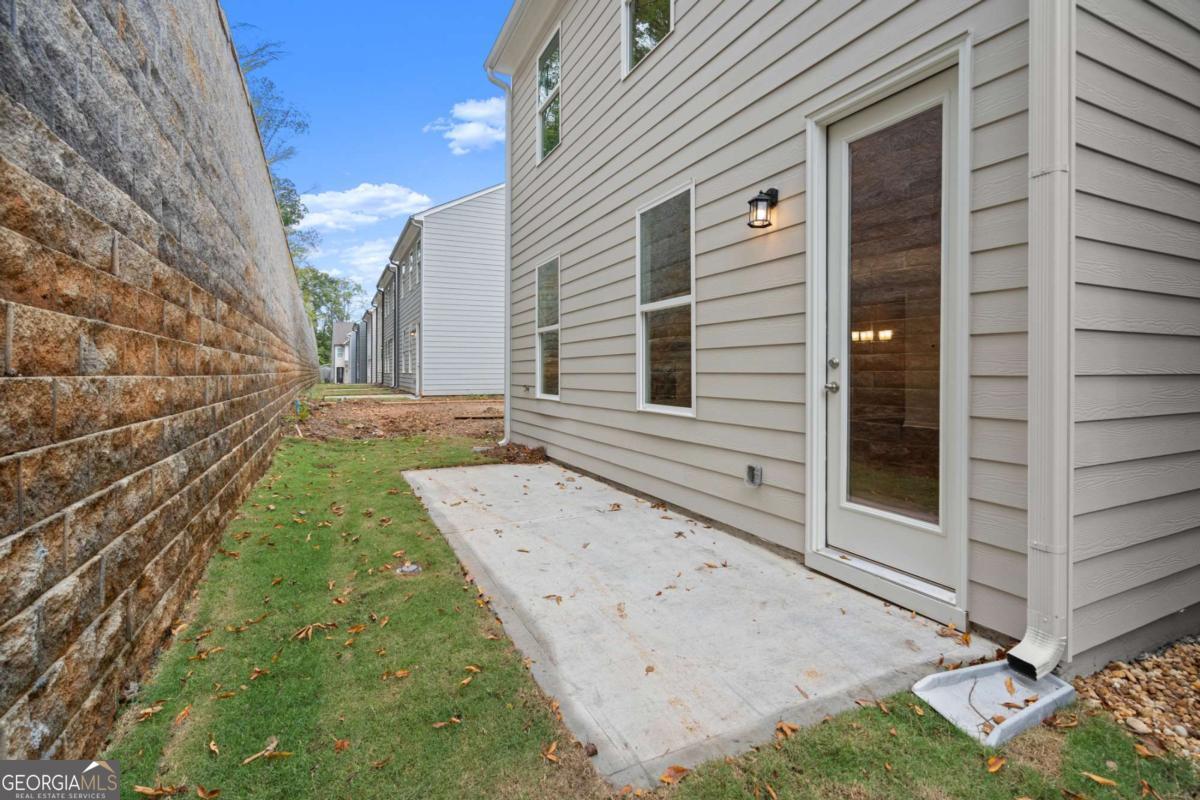 706 Smokey Quartz Way Kennesaw, GA 30144 - Photo 32 of 35 a view of a house with a yard
