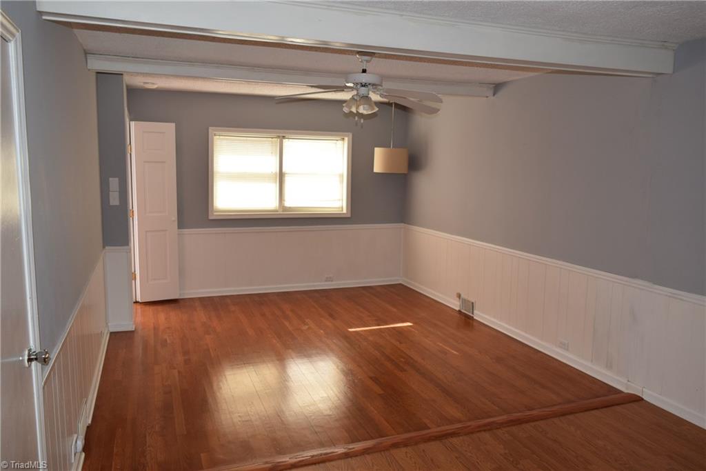 121 Oaklawn Road Mount Airy, NC 27030 - Photo 14 of 21 Main bedroom looking toward windows at front of home. Hardwood floors