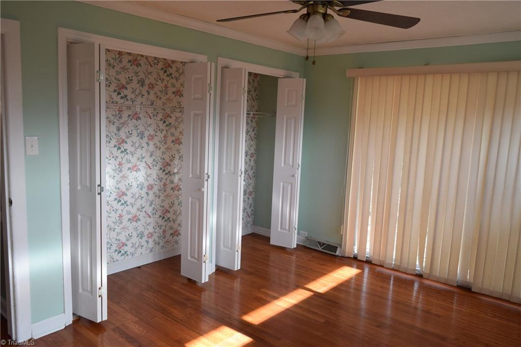 121 Oaklawn Road Mount Airy, NC 27030 - Photo 17 of 21 Second bedroom at front right corner of home. Large closet. Curtains over sliding glass doors which lead to large deck on right side of home