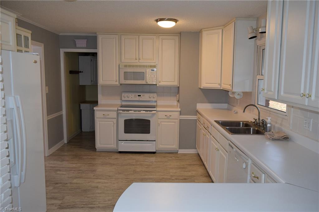 121 Oaklawn Road Mount Airy, NC 27030 - Photo 9 of 21 Kitchen with refrigerator, microwave, oven/range, dishwasher, stainless steel double sink