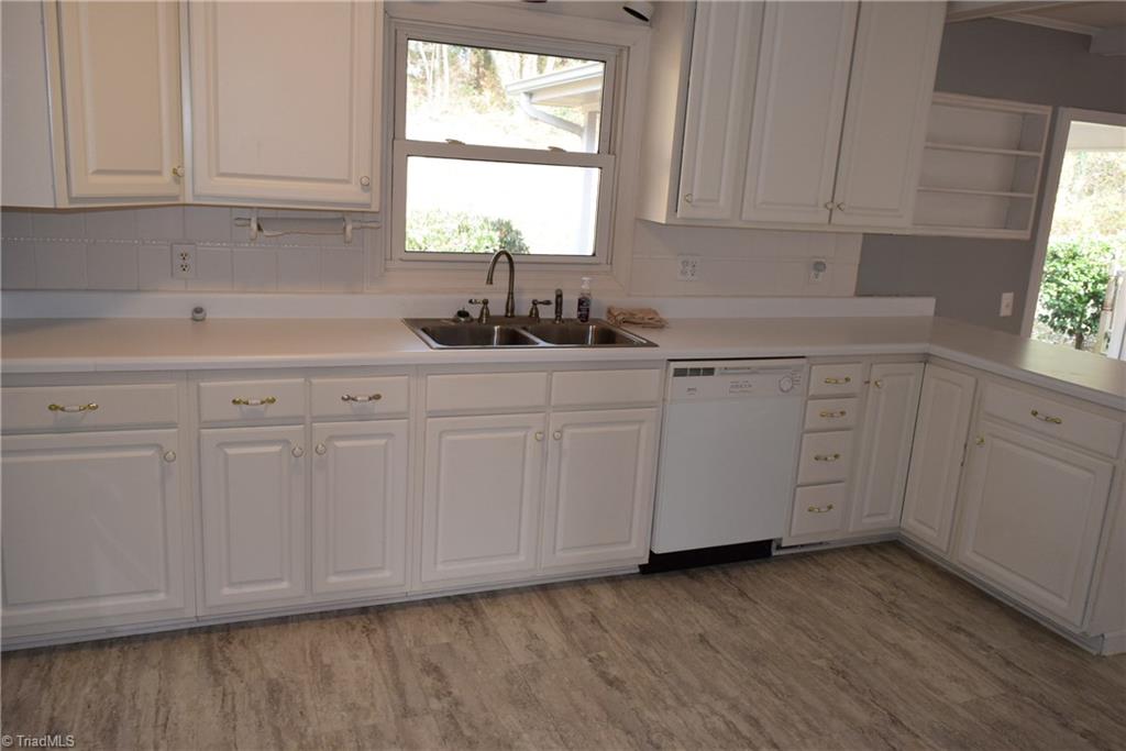 121 Oaklawn Road Mount Airy, NC 27030 - Photo 10 of 21 Kitchen with double stainless steel sink and dishwasher with many cabinets and drawers for storage