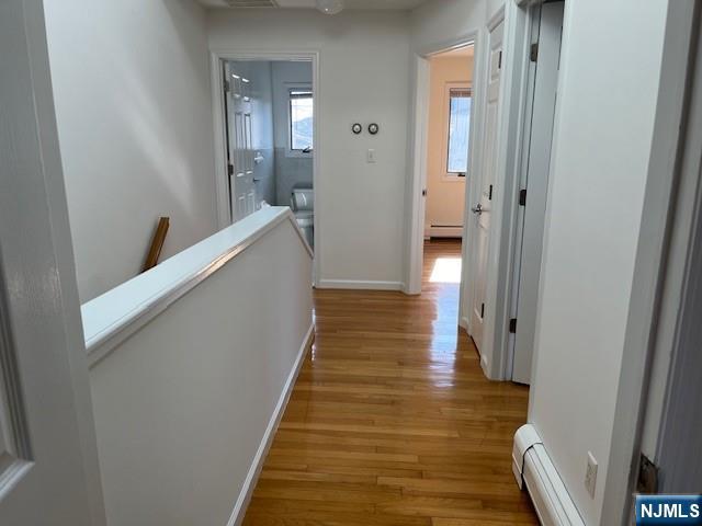 2440 B 3rd Street Fort Lee, NJ 07024 - Photo 11 of 16 a view of a hallway with wooden floor and staircase