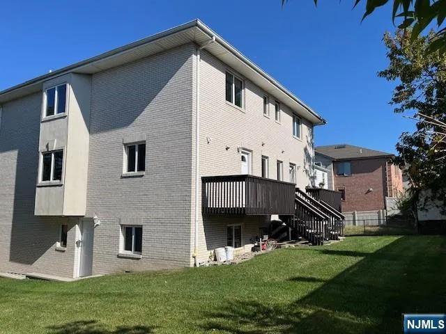 a view of house with backyard