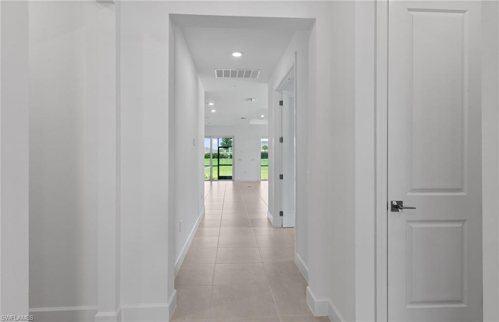 42544 Adirondack Drive Punta Gorda, FL 33982 - Photo 4 of 29 a view of a hallway with wooden floor