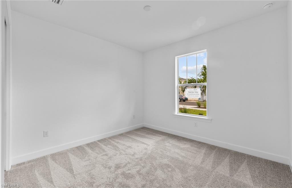 42544 Adirondack Drive Punta Gorda, FL 33982 - Photo 7 of 29 an empty room with windows