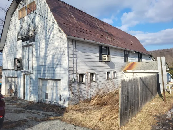 a front view of a house with parking
