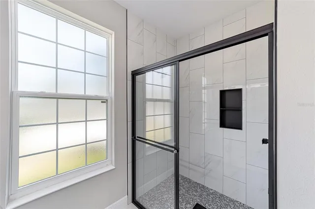 a bathroom with a bathtub and shower