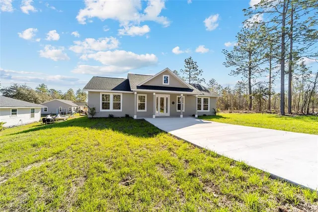 an aerial view of a house with swimming pool