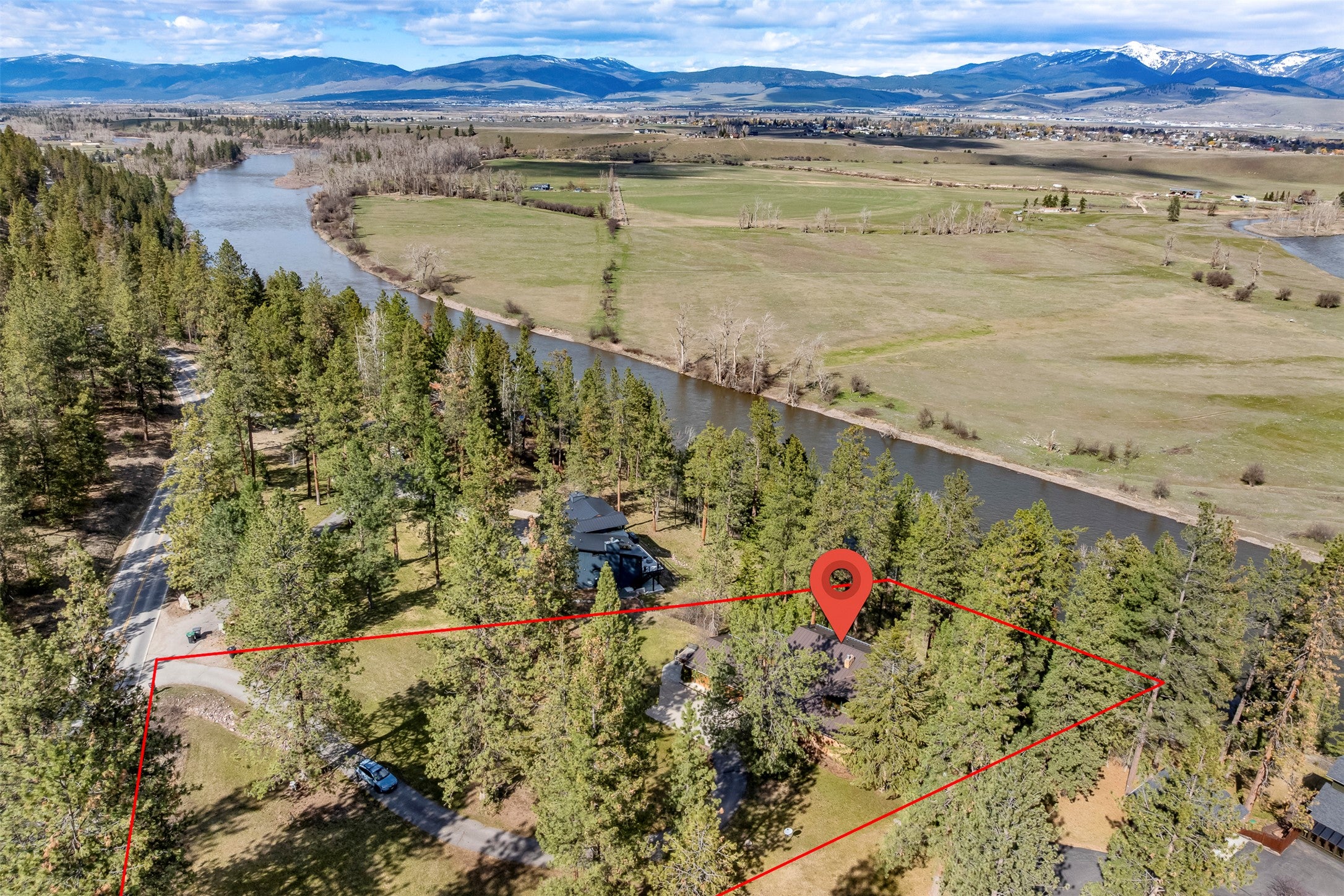 730 Big Flat Road Missoula, MT 59804 - Photo 19 of 59 Aerial view of property and surrounding area featuring property parcel outlined and a water and mountain view
