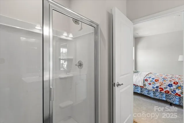 a bedroom with a bed and a mirror