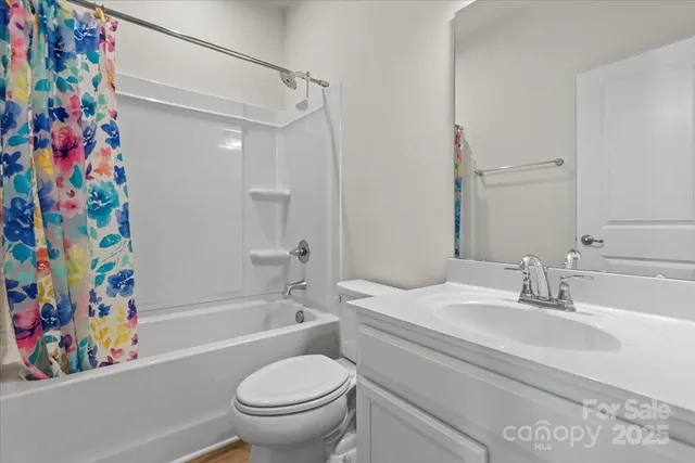 a bathroom with a sink a toilet and a bathtub