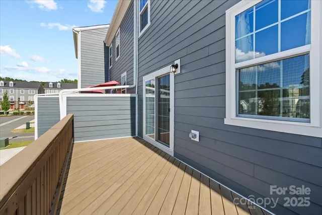 a balcony view with a glass door