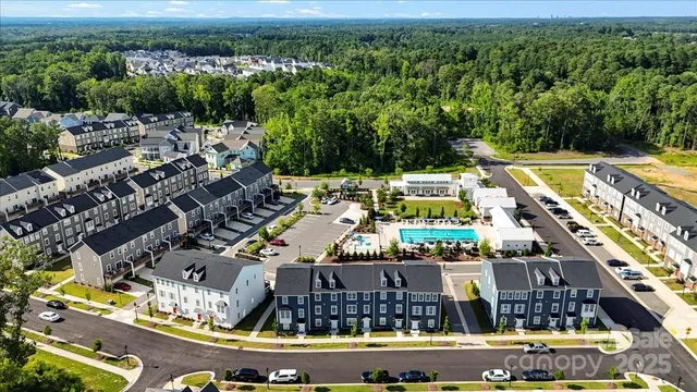 a view of swimming pool with outdoor seating and yard