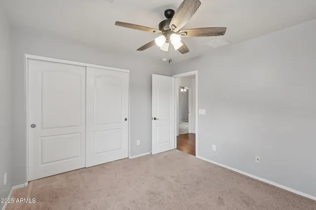 a bath tub sitting in a bathroom next to a window