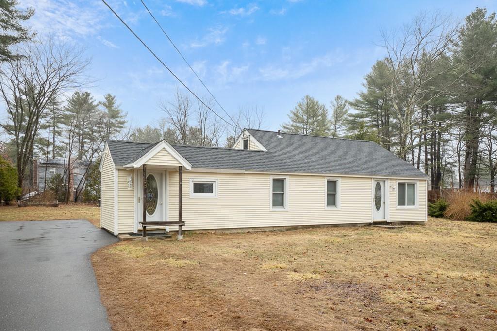 68 Lowell Road Pepperell, MA 01463 - Photo 1 of 24 a view of a house with a yard