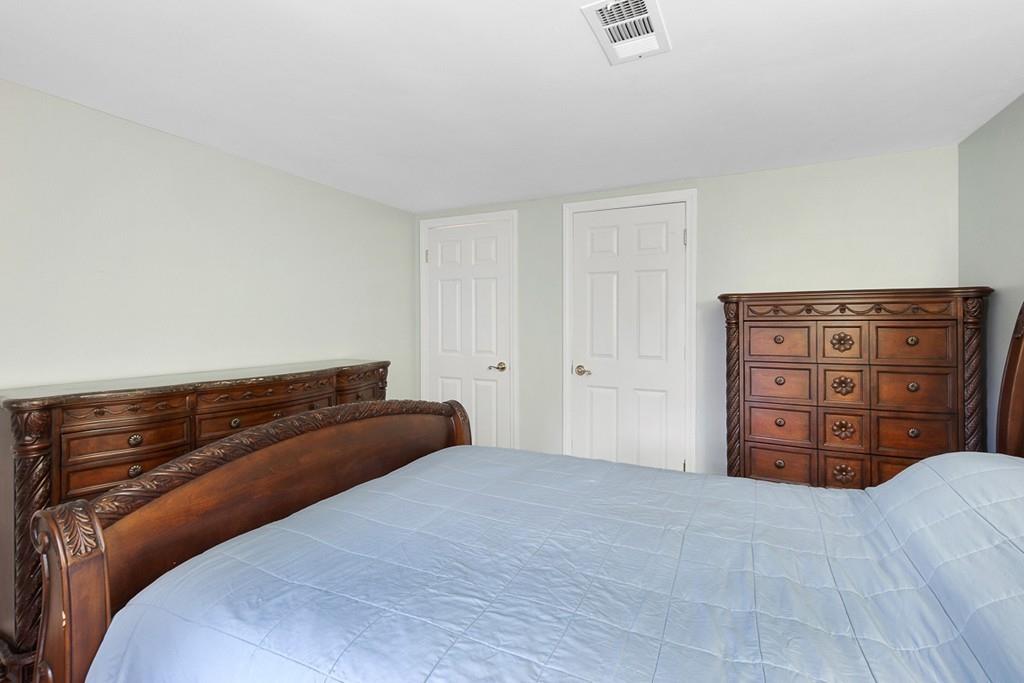 68 Lowell Road Pepperell, MA 01463 - Photo 17 of 24 a bedroom with a bed and a dresser