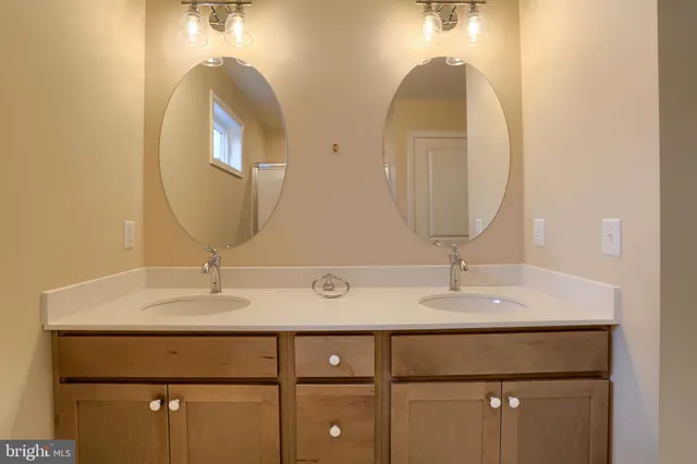 a bathroom with a glass shower door