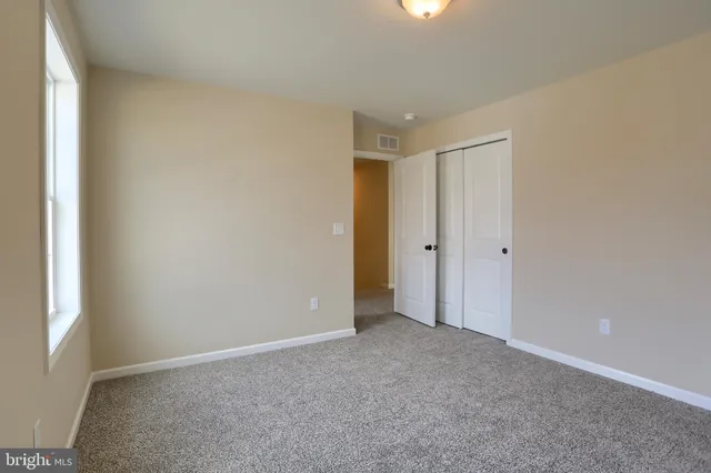 a bathroom with a sink double vanity and a shower