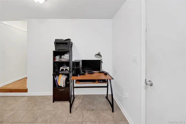 a room with furniture and white walls