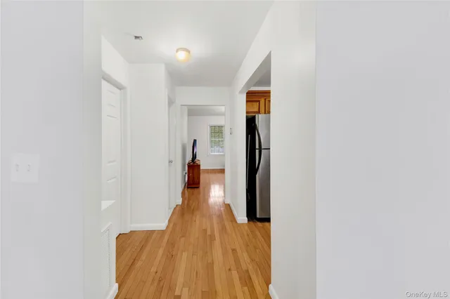 a view of kitchen and wooden floor