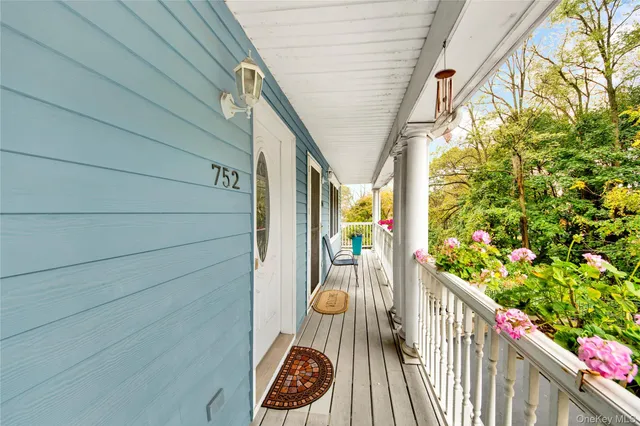 a balcony with wooden floor