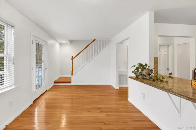 a view of a living room and kitchen