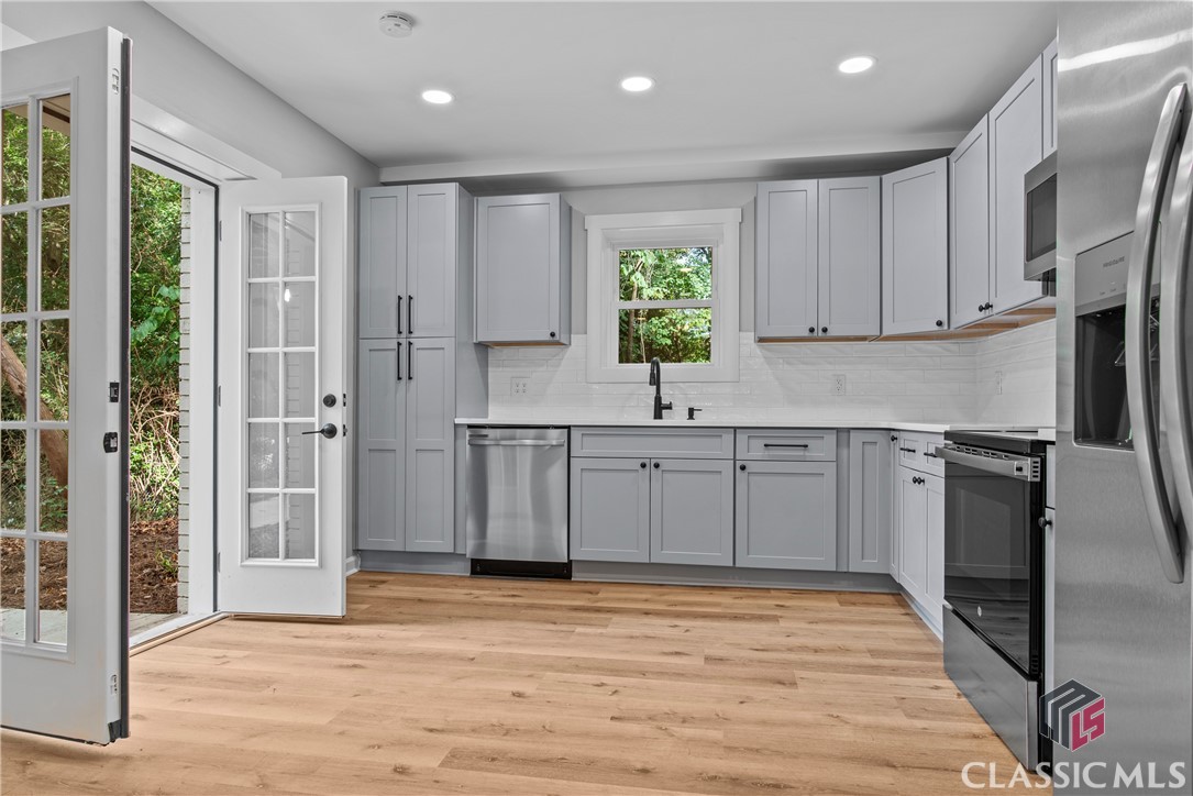 501 Cherokee Ridge Athens, GA 30606 - Photo 29 of 42 Double French Doors to Lower Level Kitchen