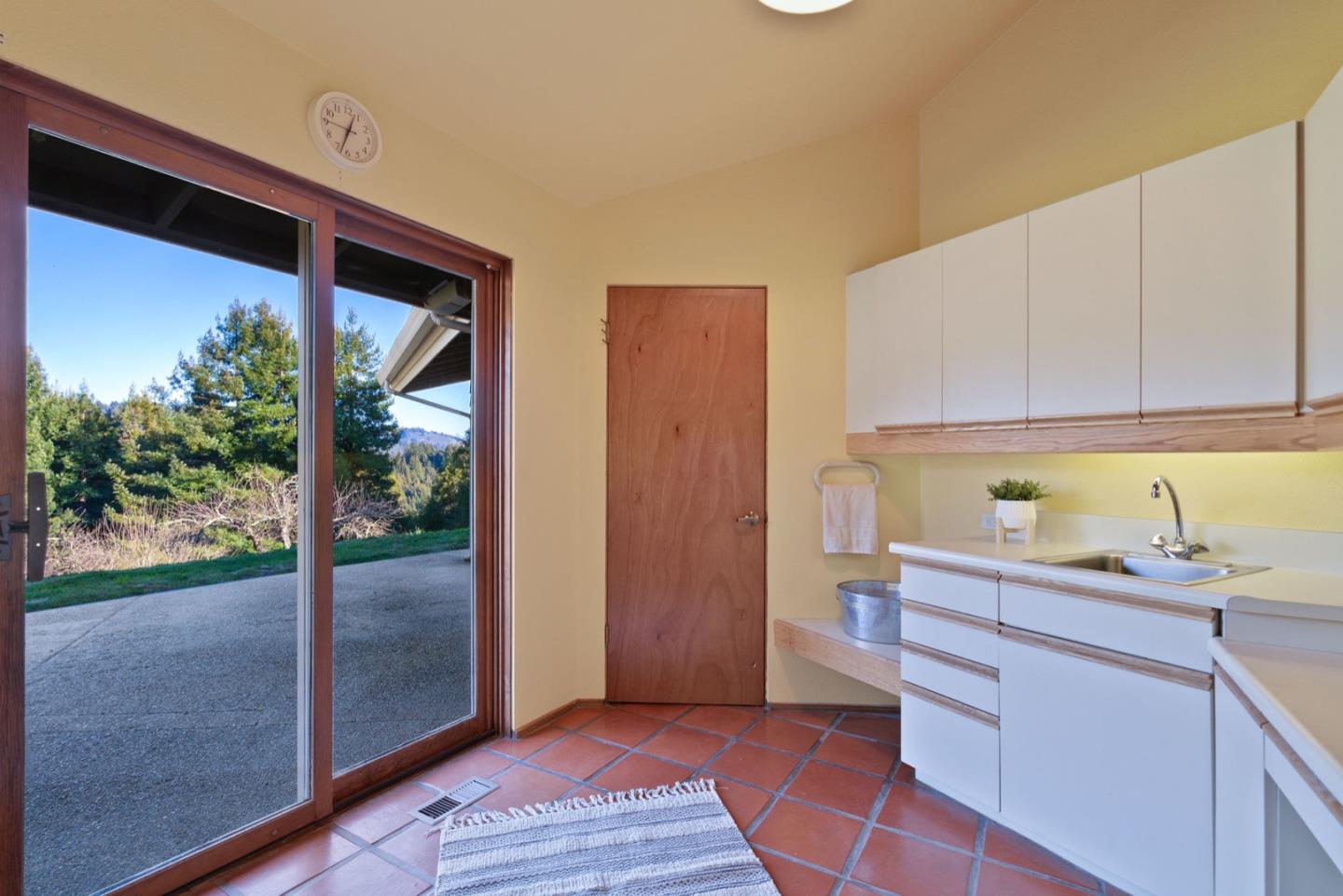 195 Raptor Road Watsonville, CA 95076 - Photo 21 of 63 a kitchen with a sink and a refrigerator