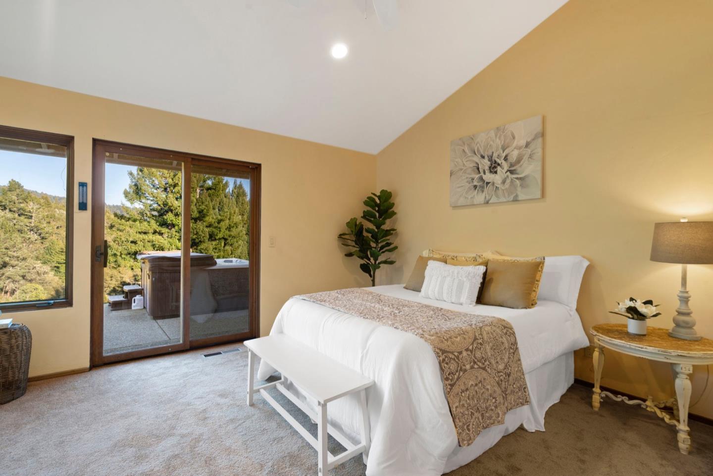 195 Raptor Road Watsonville, CA 95076 - Photo 29 of 63 a spacious bedroom with a bed and a lamp next to a window