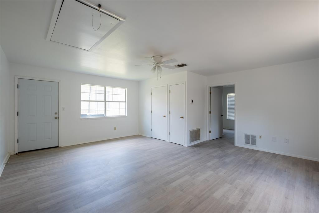 3126 Colgate Avenue Tyler, TX 75701 - Photo 28 of 33 an empty room with wooden floor and windows