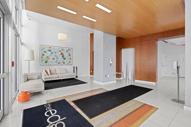 a living room with furniture and next to a window