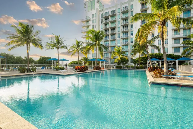 a view of residential house with outdoor space and lake view