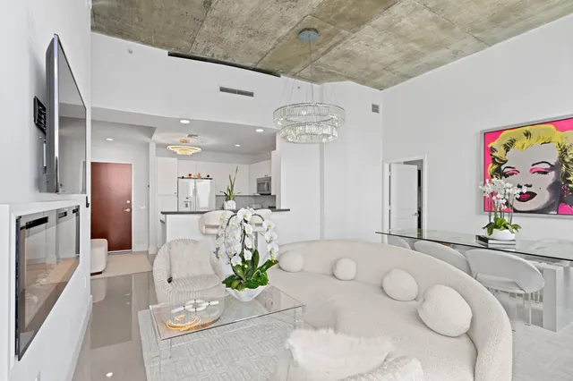 a living room with furniture and a table