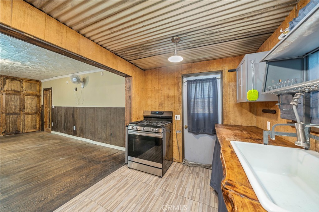 1501 Oriole Road Wrightwood, CA 92397 - Photo 16 of 29 a view of a kitchen with a sink and a stove
