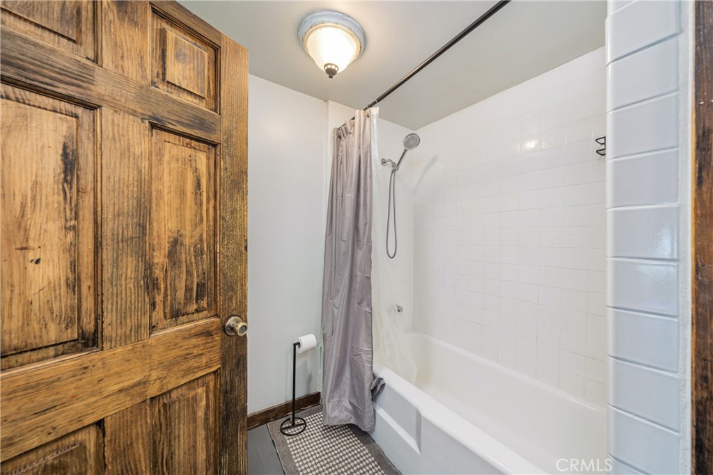 1501 Oriole Road Wrightwood, CA 92397 - Photo 20 of 29 a bathroom with a bathtub and a shower