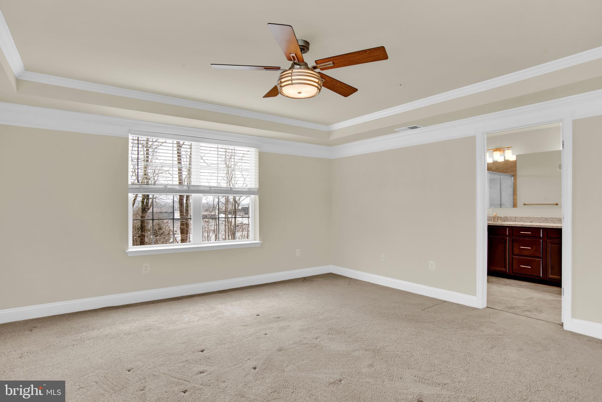 1227 Orchid Road Gambrills, MD 21054 - Photo 18 of 39 Primary bedroom w/ceiling fan & upgraded molding