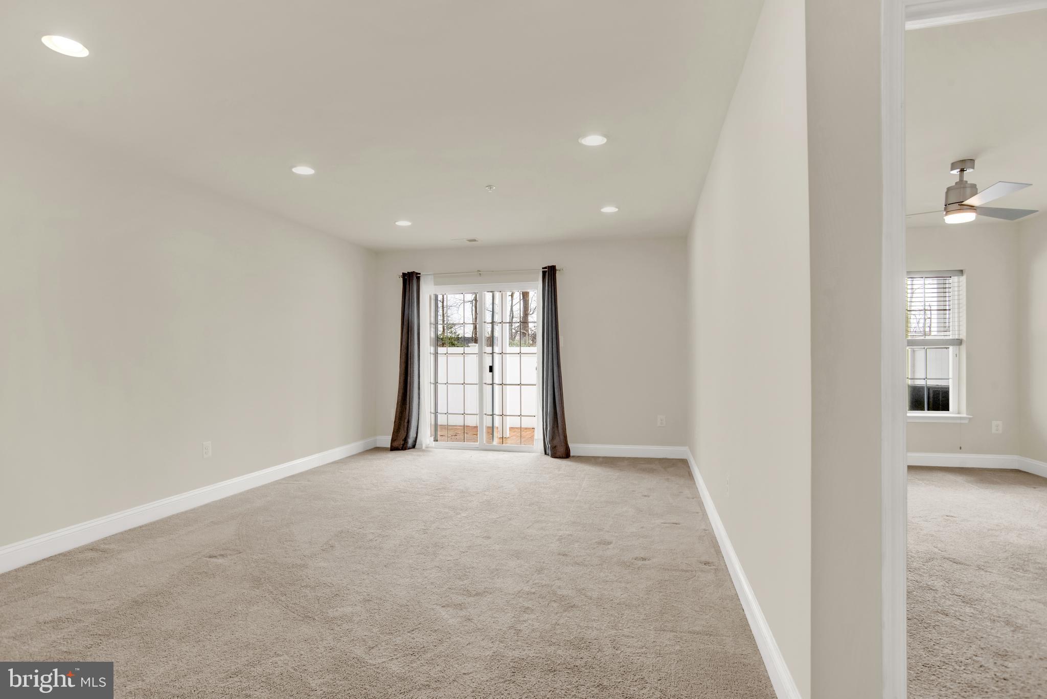 1227 Orchid Road Gambrills, MD 21054 - Photo 29 of 39 Main level family room with doors to custom patuio