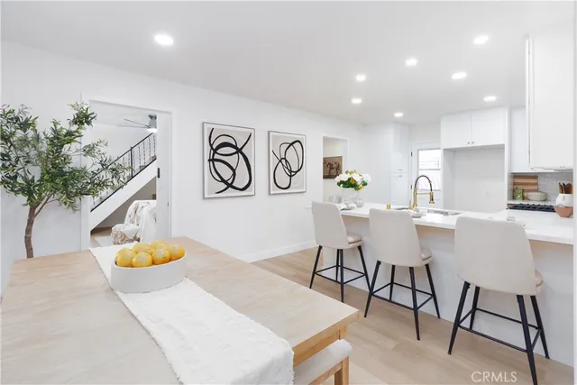 a view of a room with furniture and window